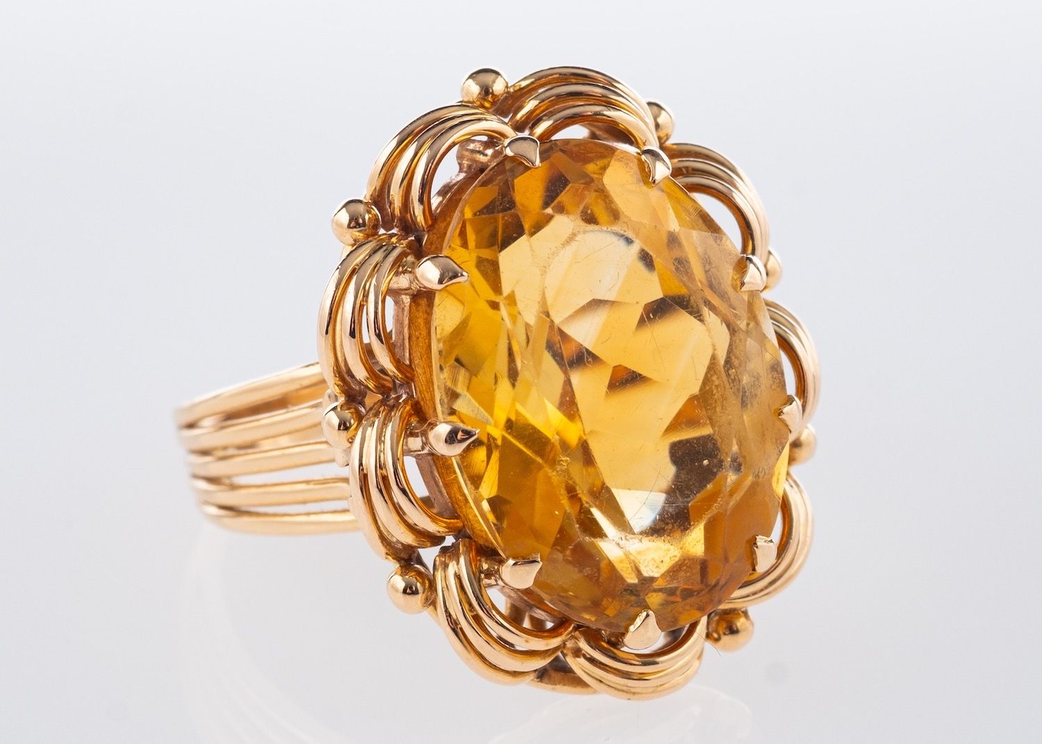 A cocktail ring, set with an oval mixed-cut citrine, citrine approx. 13.