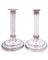 A pair of Sheffield Plated candlesticks of Robert Adam design, with ram's head motifs, 29.