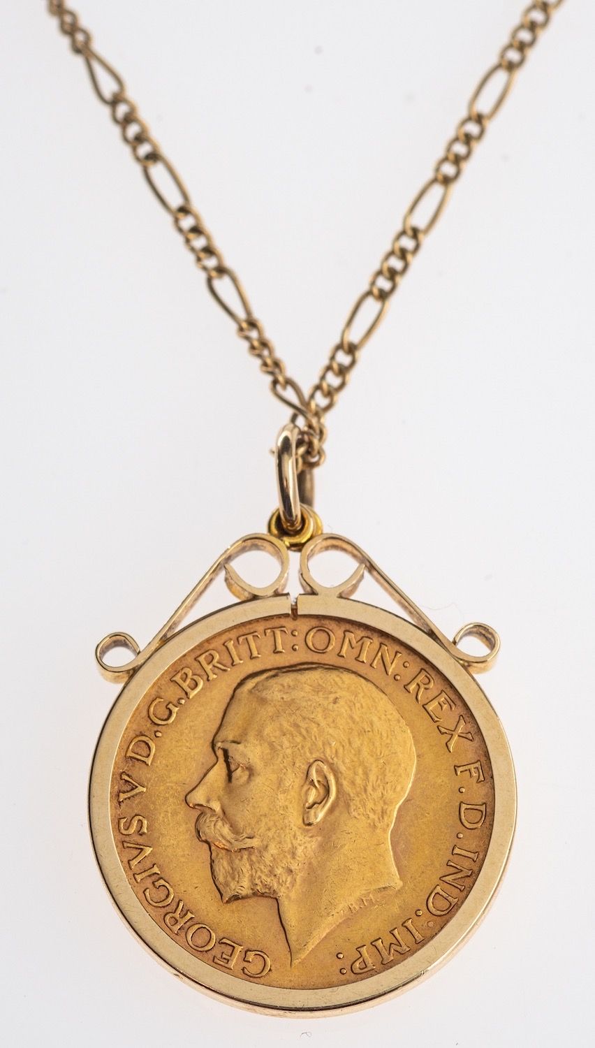 A full sovereign in pendant mount and chain,