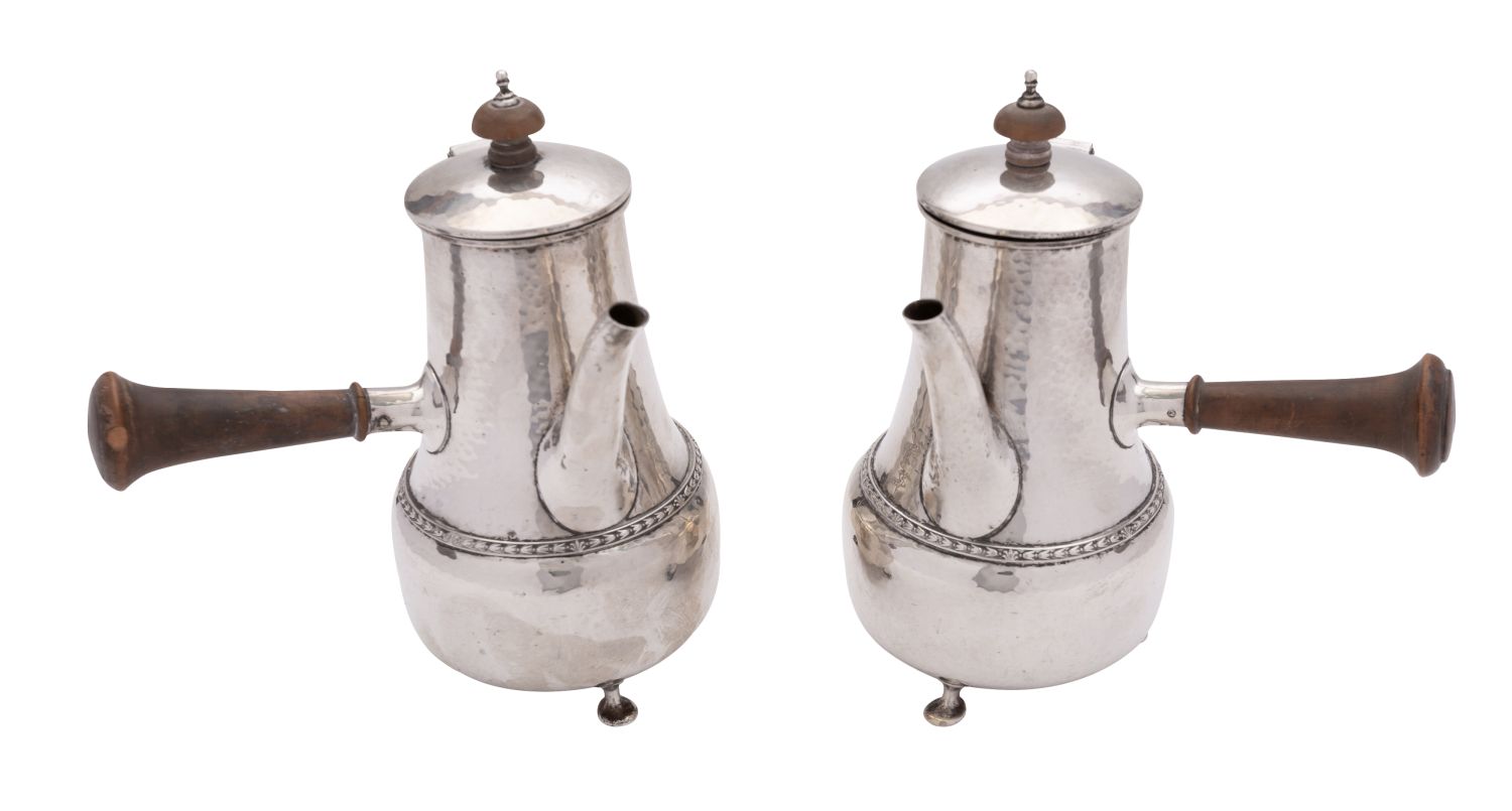 A pair of Arts and Crafts hammered silver café au lait pots by Phillip Hanson Abbott. - Image 2 of 2