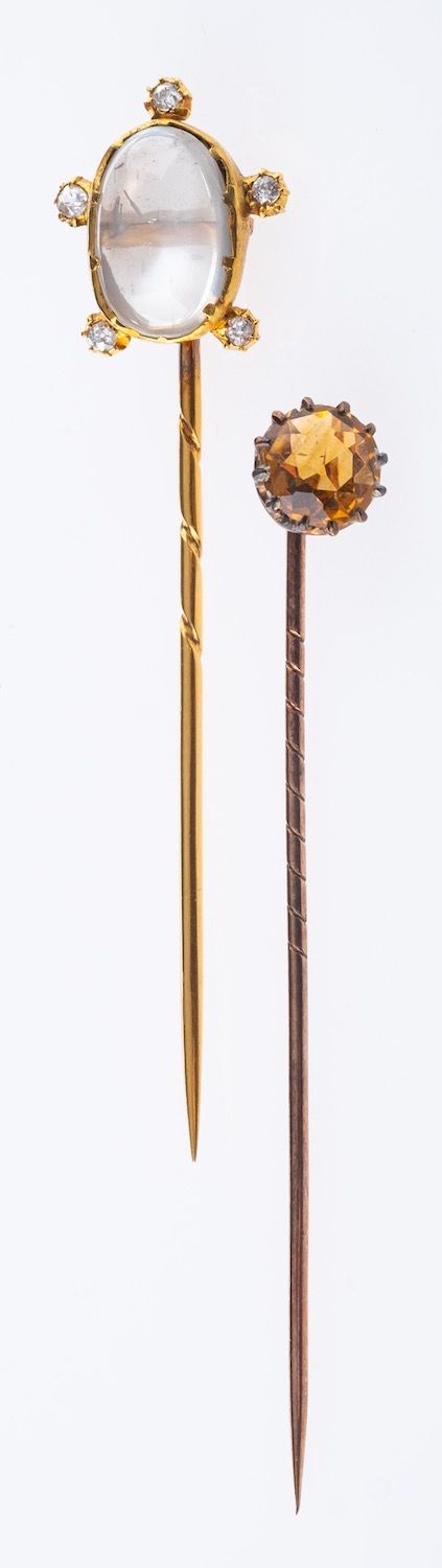 A group of two stick pins,