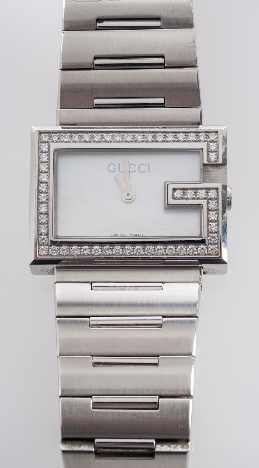 Gucci, a stainless steel and diamond wristwatch, with quartz movement,