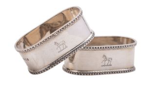A pair of George V cased silver napkin rings by Asprey & Co Ltd, London 1925, of oval form,