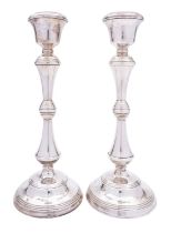 A pair of Elizabeth II silver candlesticks by W. I .