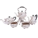 A George V five piece silver tea and coffee service by Mappin & Webb, London 1915, barge shape,