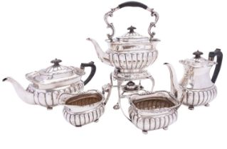 A George V five piece silver tea and coffee service by Mappin & Webb, London 1915, barge shape,
