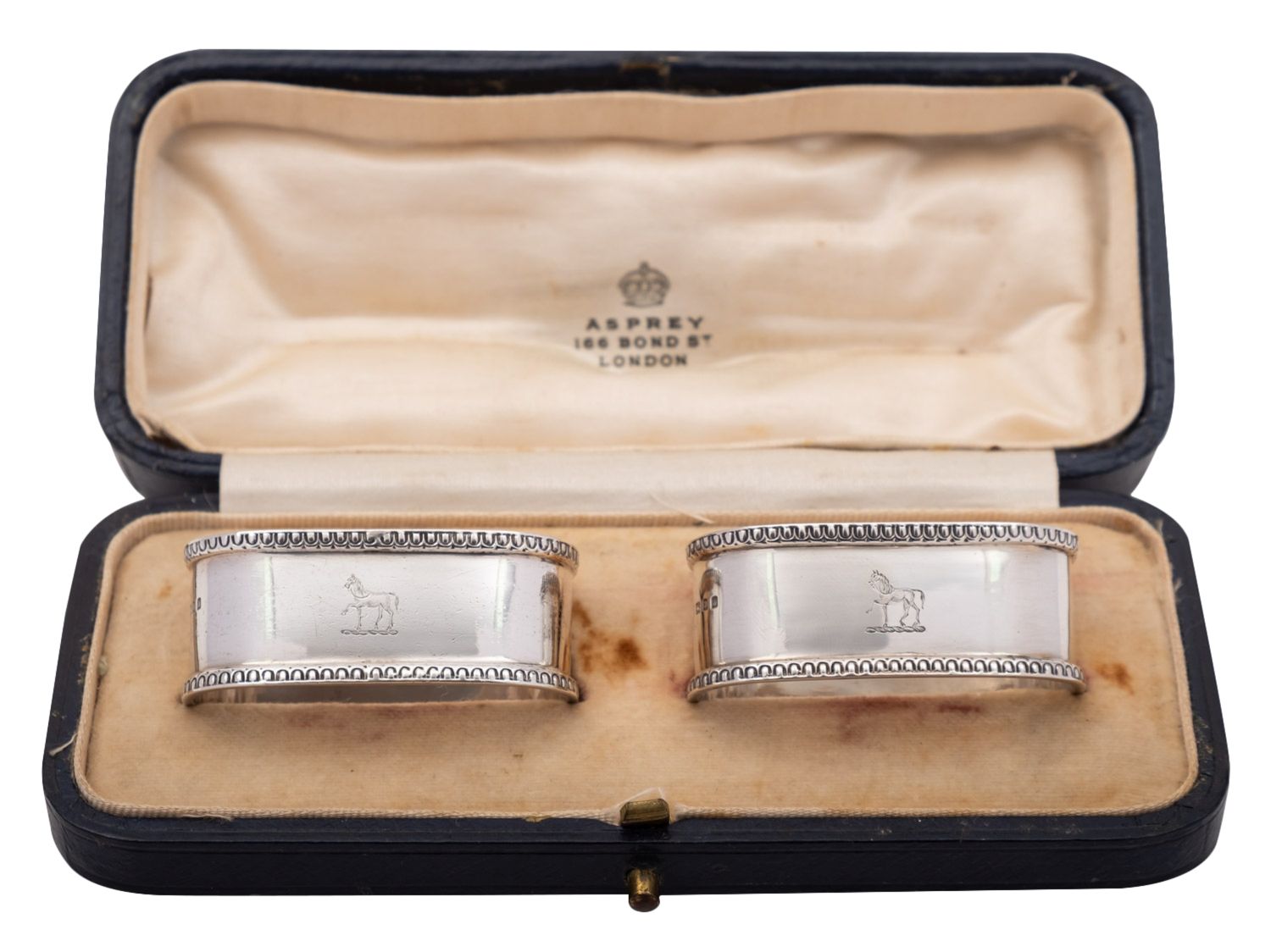 A pair of George V cased silver napkin rings by Asprey & Co Ltd, London 1925, of oval form, - Image 2 of 3