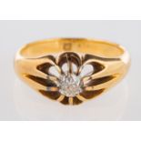 An antique single stone ring, set with an old European-cut diamond in a 'gypsy' style setting,