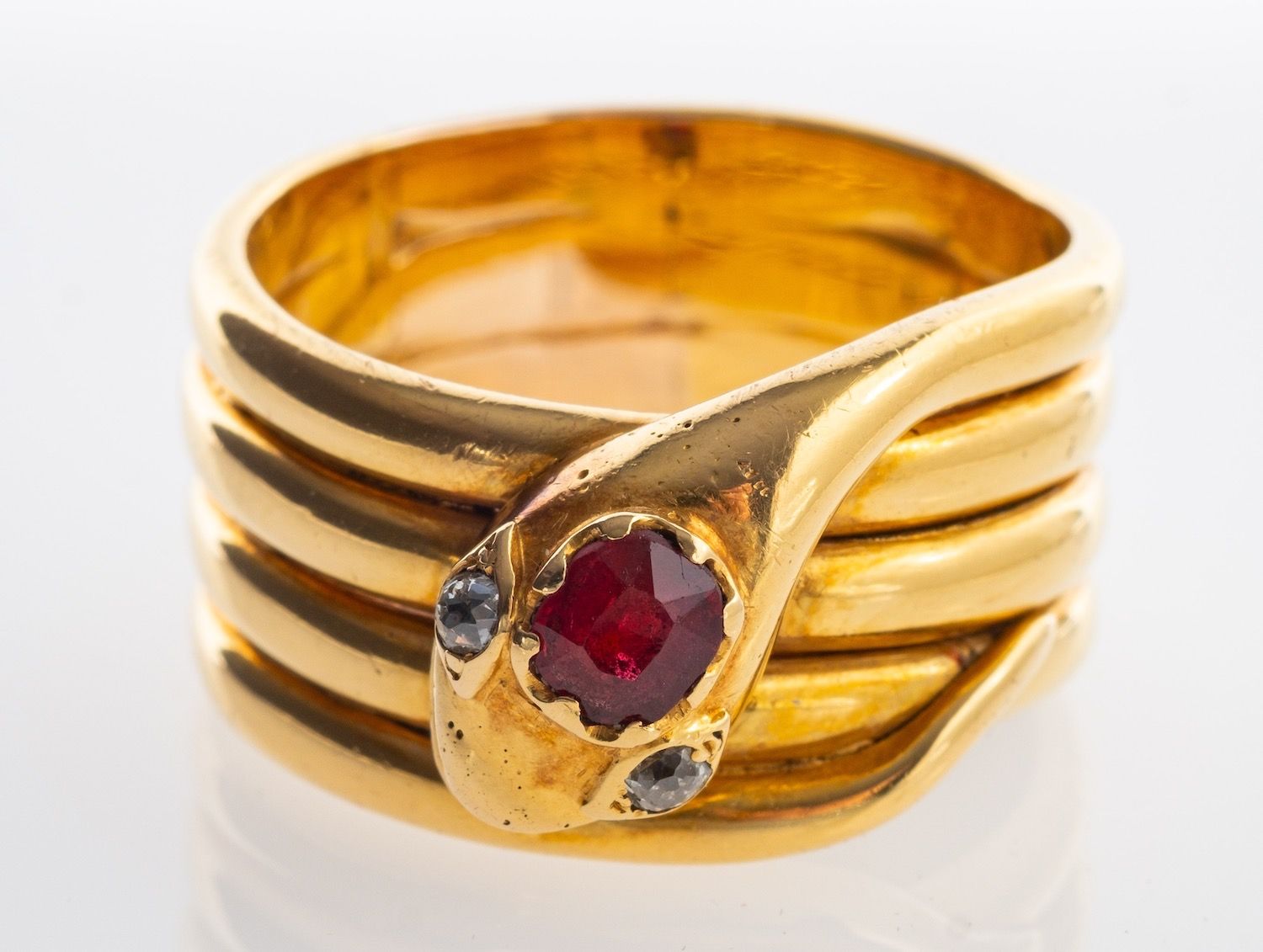 A Victorian snake ring, a coiled snake designed ring, its head set with an oval-cut ruby, - Image 3 of 4