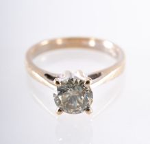 A single stone solitaire ring, high set with a brilliant-cut diamond in a four claw setting,