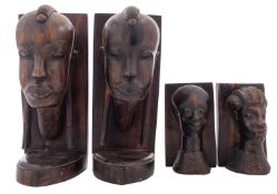 Two pairs of African carved ebony book e