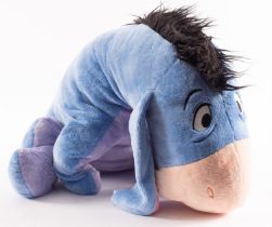 A large blue Disney soft toy of Eeyore-