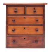 A miniature walnut chest of drawers, ear