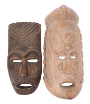 A large African carved wood mask, with a