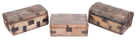 Three horse hide covered coaching trunks