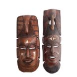 Two African carved hardwood and bone ins