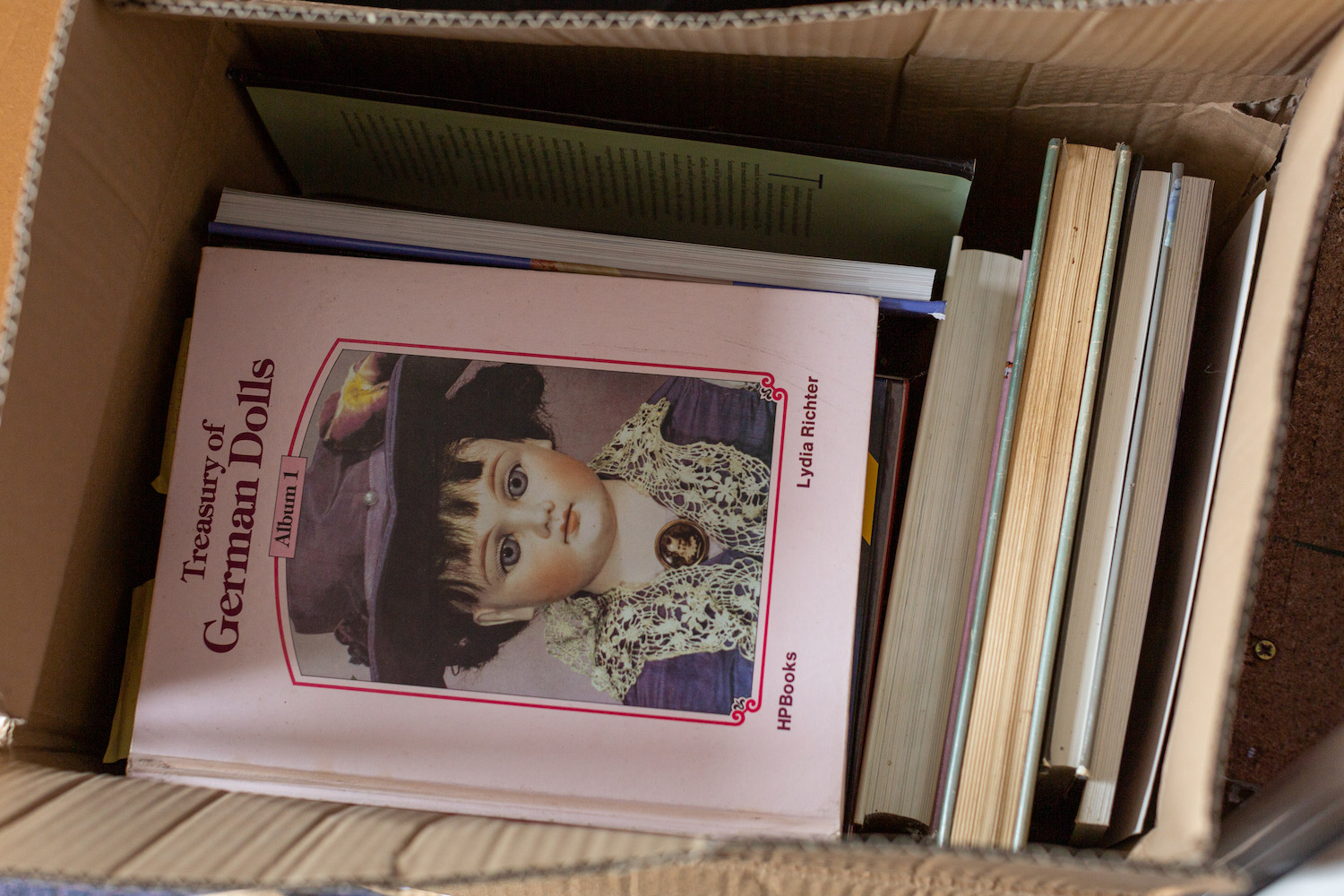 Four boxes of books and auction catalogues relating to dolls - Image 3 of 3