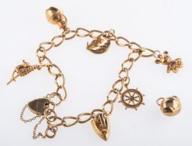 A 9ct yellow gold charm bracelet, of cur