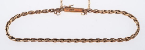 A 9ct yellow gold twist link chain bracelet, with safety chain, UK hallmark, length approx. 19.