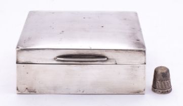 A silver cigarette casket, marks heavily