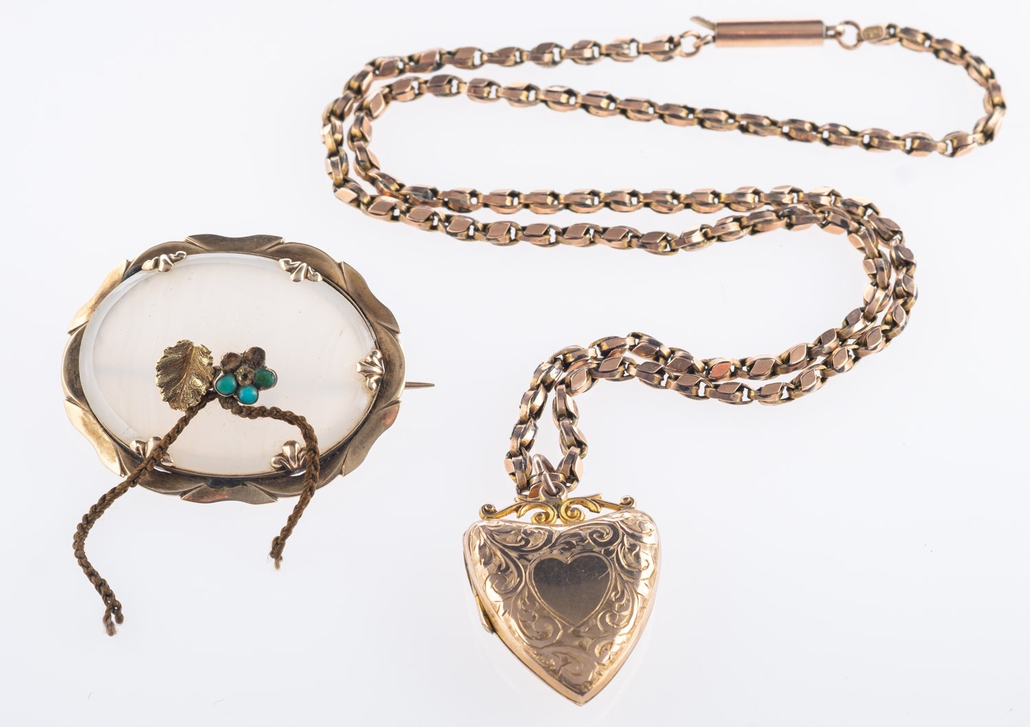 A locket pendant and brooch, a heart sha