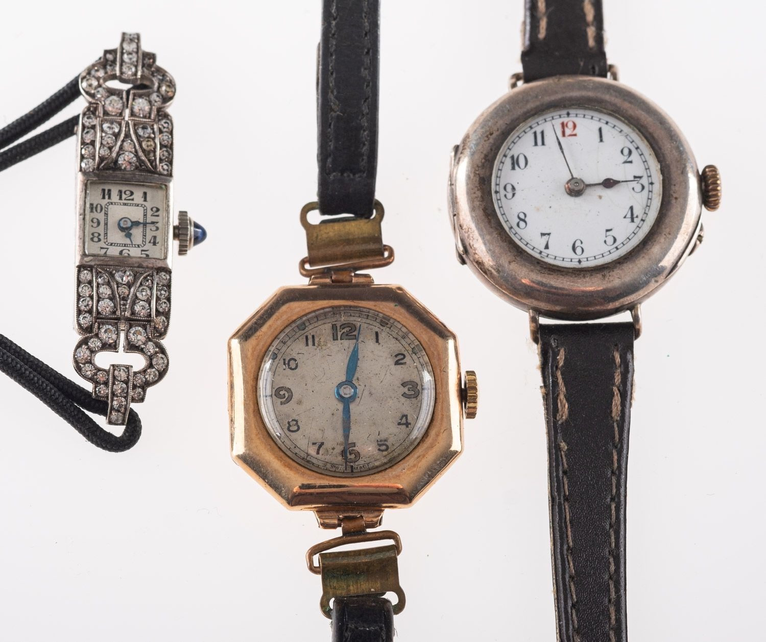 A silver cased lady's cocktail wristwatch and two other leather band gentleman's wristwatches.