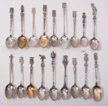 A collection of French and continental teaspoons, mostly souvenir with armorial terminals,