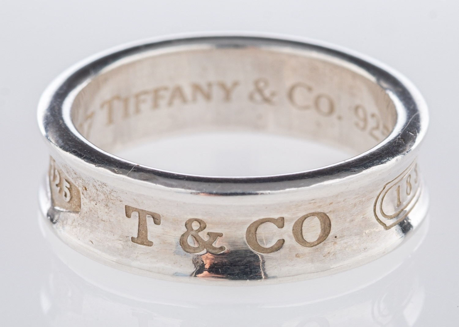 Tiffany & Co. A silver concave style rin