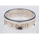 Tiffany & Co. A silver concave style rin