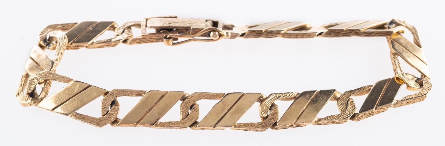 A curb link bracelet, with polished and