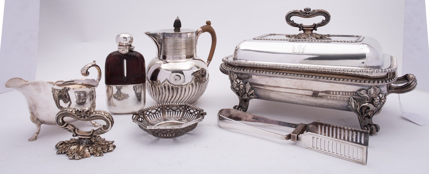 A group of silver plated items, comprising of; a glass and leather sprit flask with bayonet lid,
