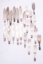 A group of silver fish knives and forks,