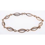 A textured link bracelet, of oval links,