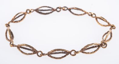 A textured link bracelet, of oval links,