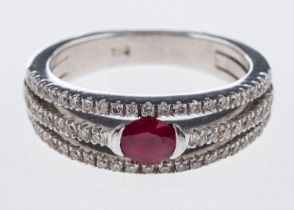 A diamond and ruby ring the central oval
