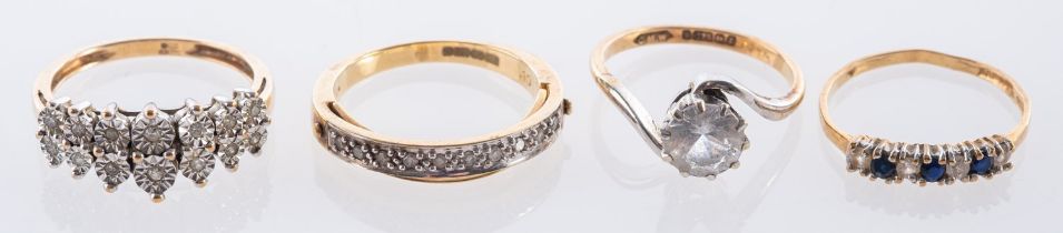 Four 9ct yellow gold rings, including a