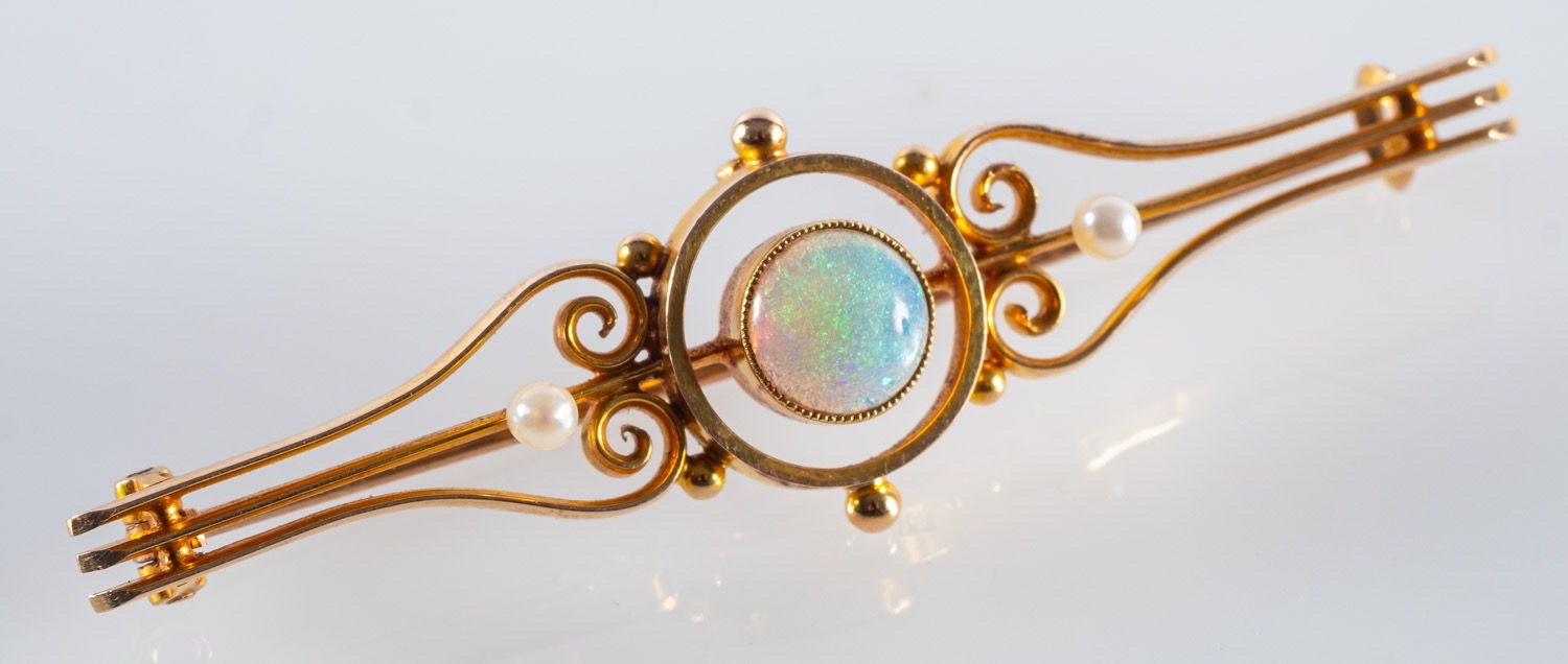 A gold and opal bar brooch, C1900, centr