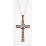 A 9ct yellow & white gold cross and chai