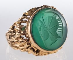 A green carved chalcedony signet ring, w