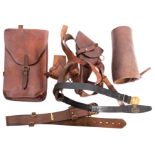 An assortment of military leather items,