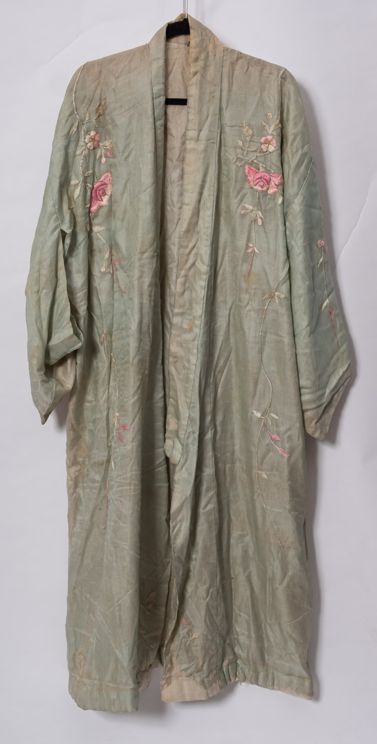 A collection of various textiles, including white ware silk shawl, two silk dressing gowns etc.