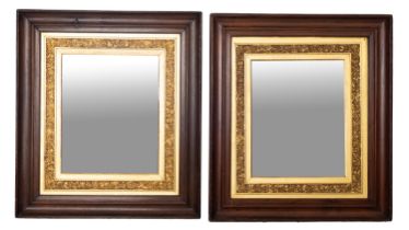 A pair of Edwardian stained wood and partly gilt rectangular mirrors,
