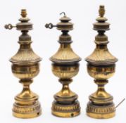 A set of three late Victorian brass electric table lamps,
