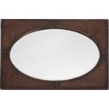 A studded leather veneered wall mirror, in Arts & Crafts taste,