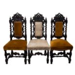 A set of three carved oak hall or dining chairs in the Carolean style,