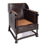 A leather covered and brass studded armchair in the 17th Century taste, circa 1920,