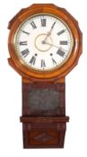 An early 20th century walnut drop-dial wall clock,