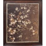 An early 20th century needlwork of birds amongst blossom, framed and glazed, 60cm x 49cm.
