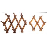 A set of Victorian articulated turned and stained beech hanging pegs,