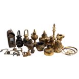 A brass domed carriage lamp with bevelled glass panels, and a collection of various brass lamps.